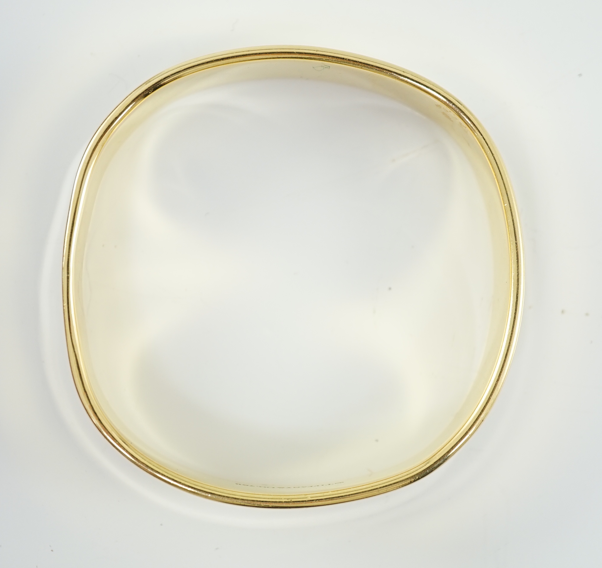 A modern heavy Tiffany & Co 18ct gold shaped bangle